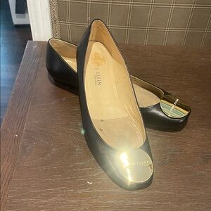 Anne Klein Women's Black Flats with Gold Medallion Accent